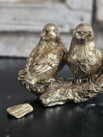 Goudkleurig vogelbeeldje op tak – Unieke Imperfectie