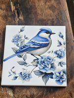 Keramisch tegeltje blauwe vogel met rozen